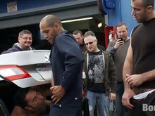 Spencer Reed and a bunch of car mechanics take turns fucking Gianni Lucca in a public auto garage.